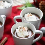 white mugs filled with mexican hot chocolate pudding