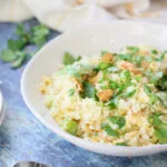 keto garlic fried cauliflower rice in a white bowl